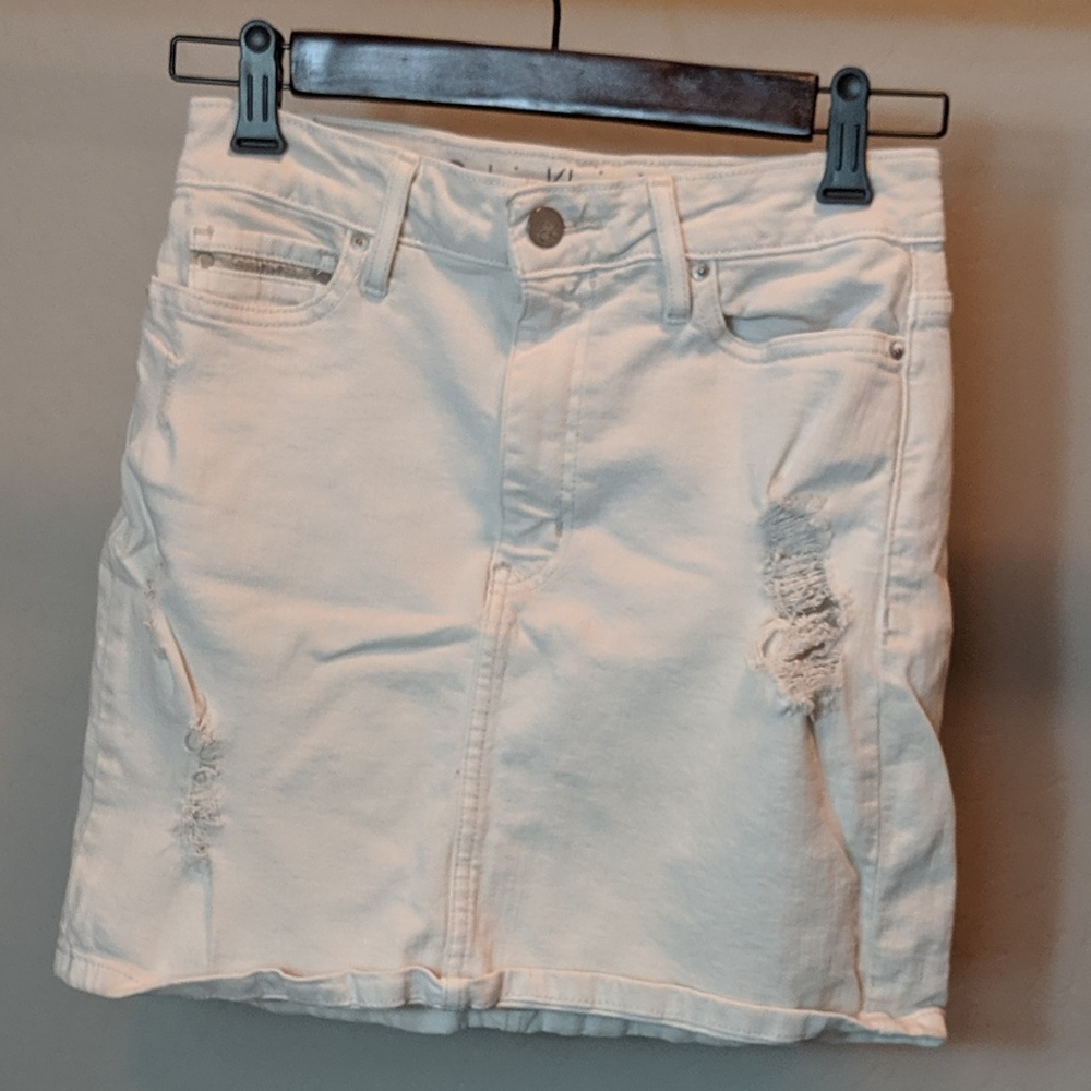 Calvin Klein off-white distressed denim skirt